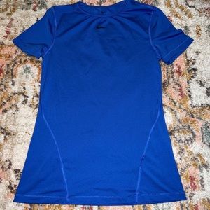 Nike running shirt. Rarely worn and never to workout.